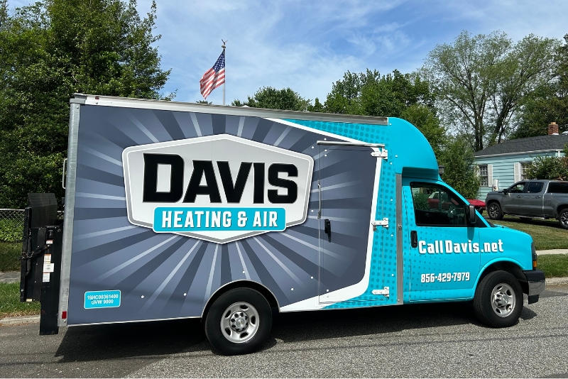 Davis Heating and Air branded vehicle delivering a new HVAC system to a local veteran for free